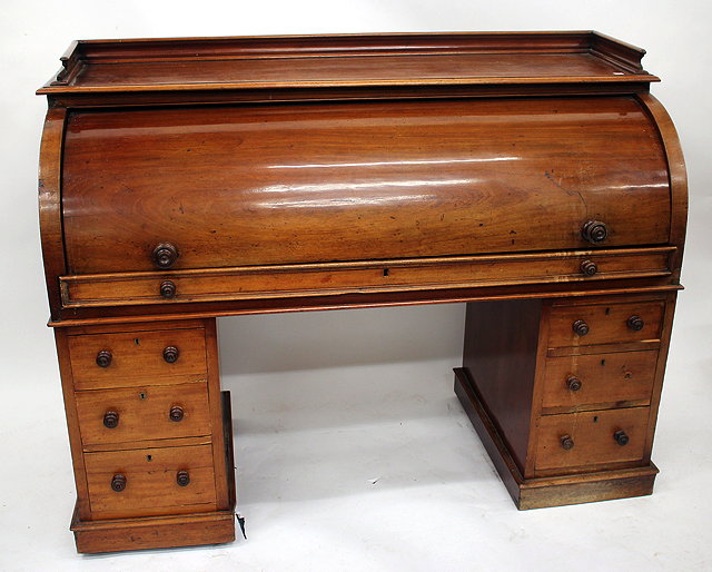 Appraisal: A TH CENTURY MAHOGANY CYLINDER TOPPED PEDESTAL DESK the top