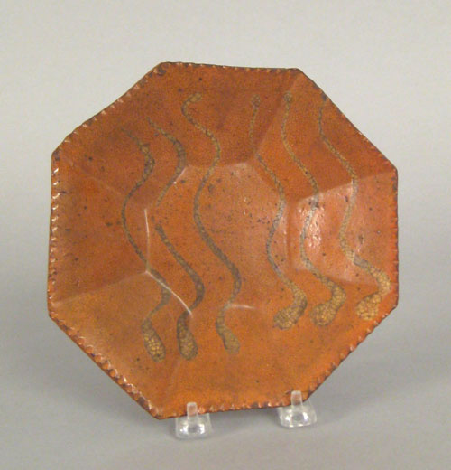 Appraisal: Octagonal redware plate th c with yellow slip wavy line