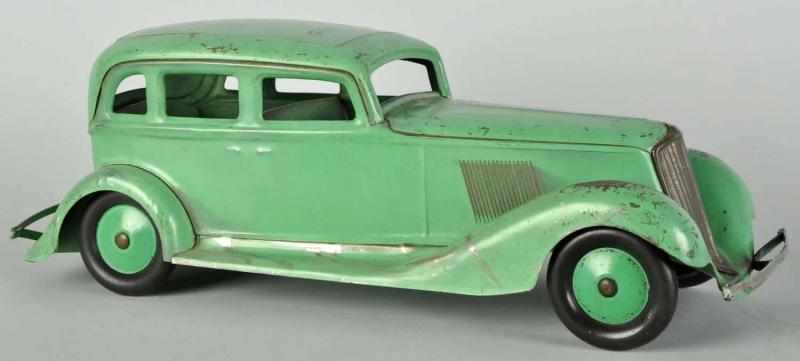 Appraisal: Pressed Steel Cor-Cor Sedan Automobile Push Toy Description American Original