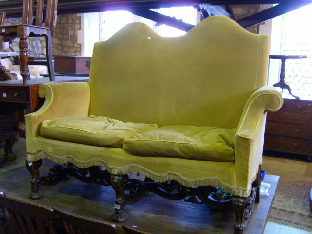 Appraisal: A Carolean style -seat sofa with shaped back and arms