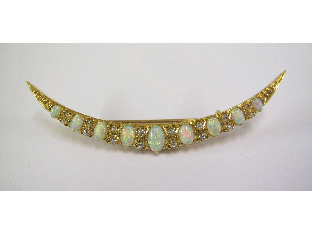 Appraisal: Victorian unmarked gold opal and diamond set crescent brooch