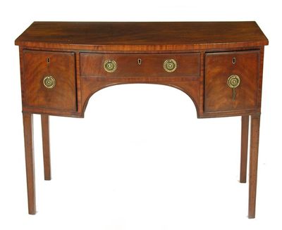 Appraisal: A th century mahogany bowfront sideboard with line inlay fitted