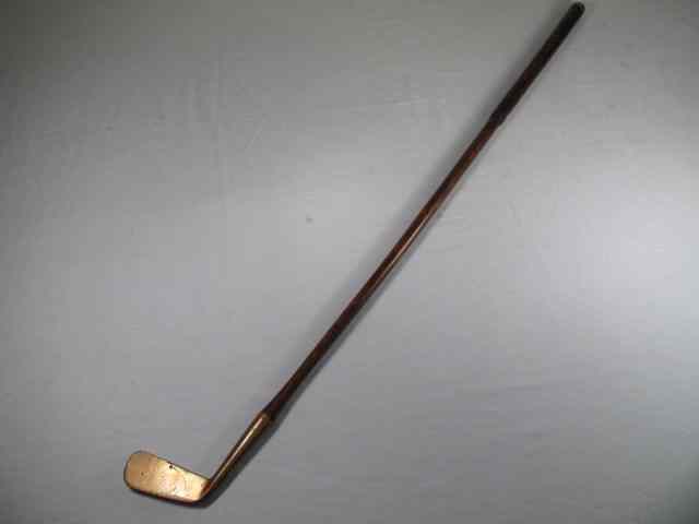 Appraisal: Gun metal brass head putter golf club Back of face