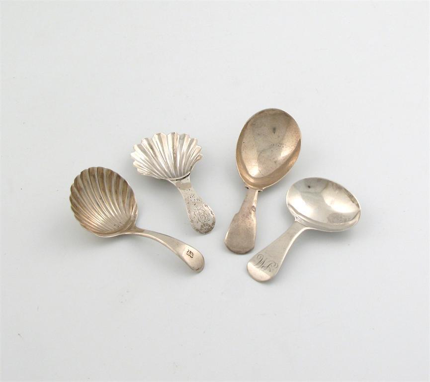 Appraisal: A small collection of four antique silver caddy spoons