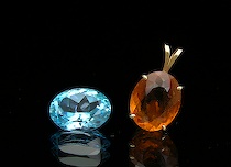 Appraisal: Loose Blue Topaz and a Citrine Pendant Oval-cut citrine gemstone