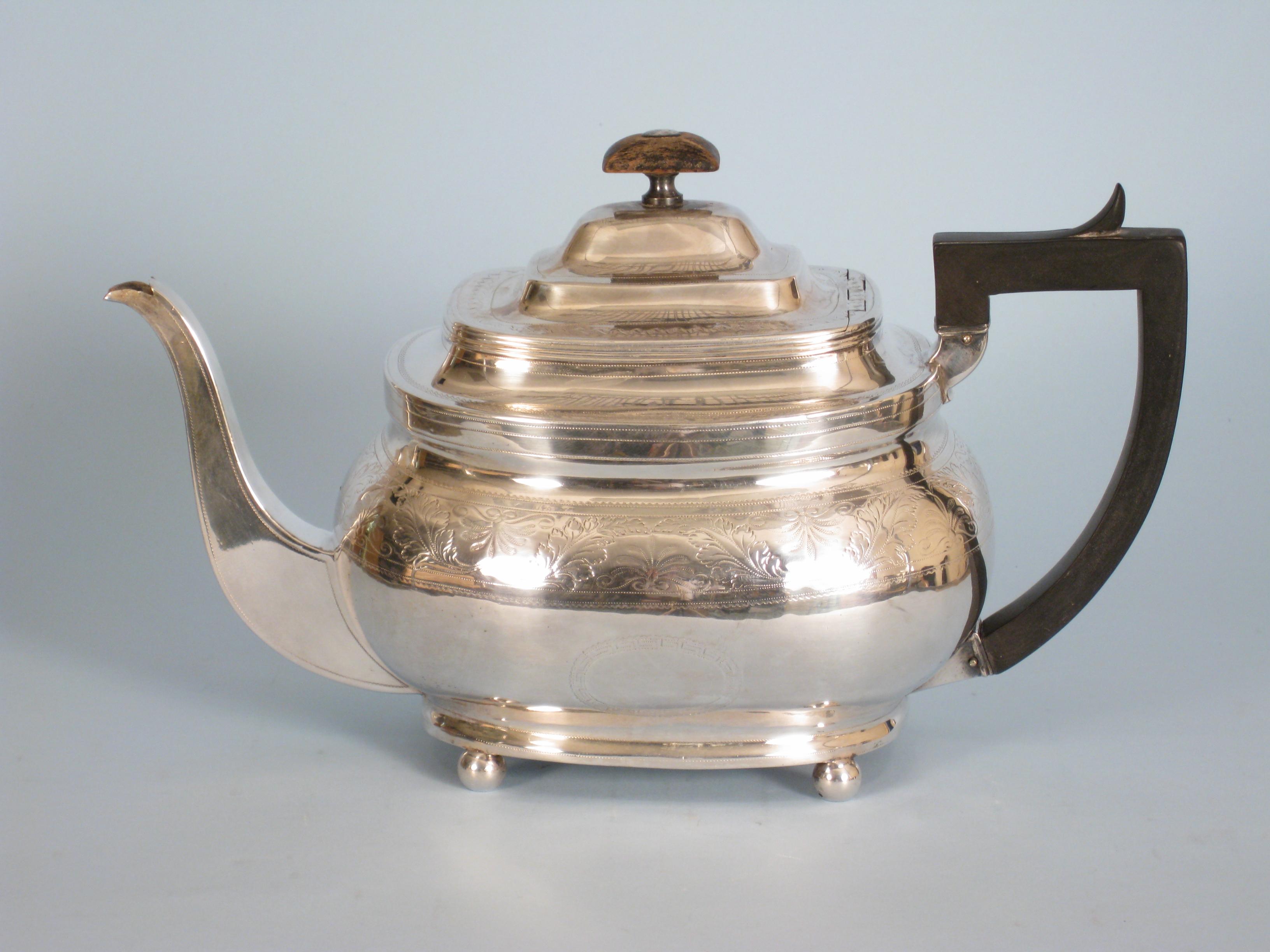 Appraisal: A George III boat shape Teapot with bright-cut leafage frieze