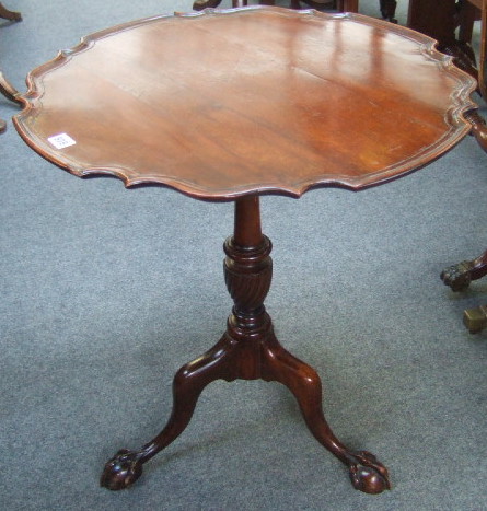 Appraisal: A mid th century style occasional table the shaped snap