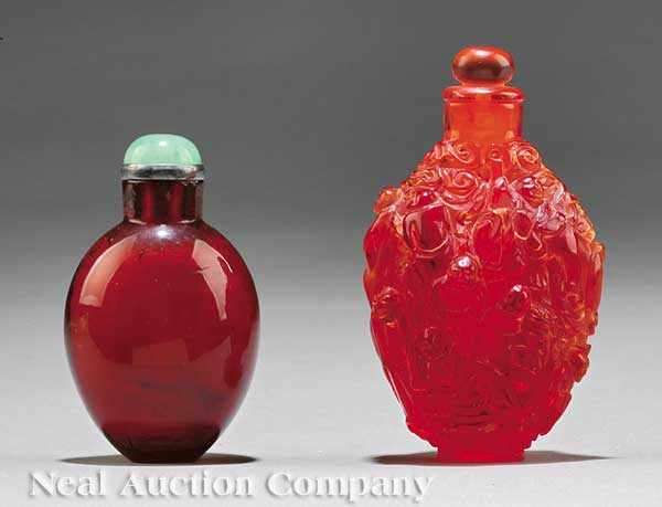 Appraisal: Two Chinese Red Amber or Amber Like Snuff Bottles the