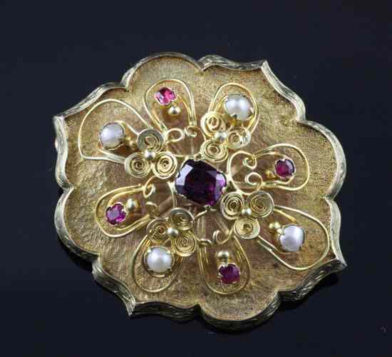 Appraisal: A Victorian ruby pearl and garnet set gold brooch with