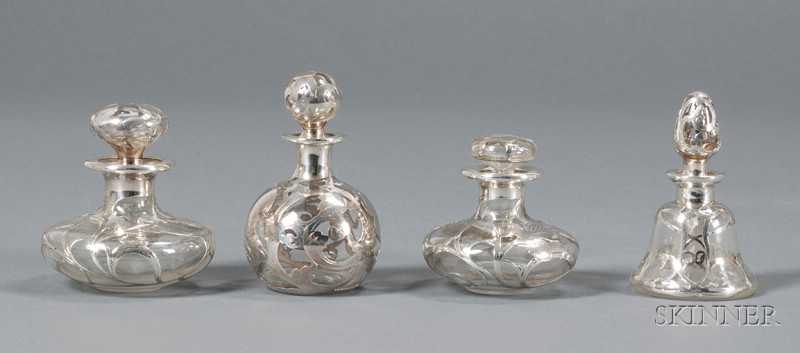 Appraisal: Four Silver Overlay Colognes Clear glass and silver th century