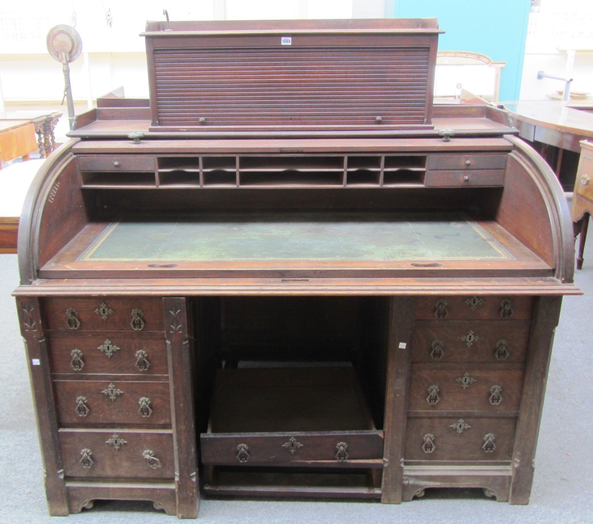 Appraisal: A th century carved oak roll top pedestal desk cm