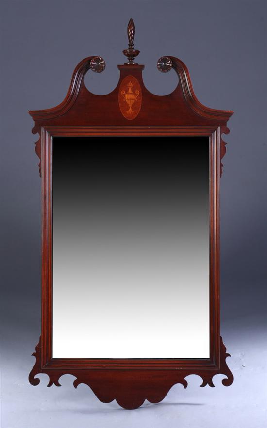 Appraisal: GEORGIAN STYLE MAHOGANY WALL MIRROR th century Finial-topped broken scrolling