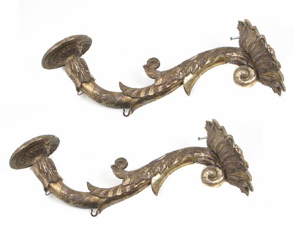 Appraisal: A pair of Italian Baroque giltwood wall sconces one damaged