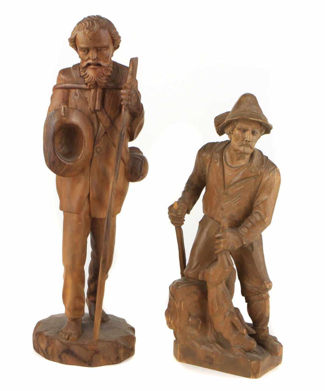 Appraisal: Two Black Forest carved walnut figures height in