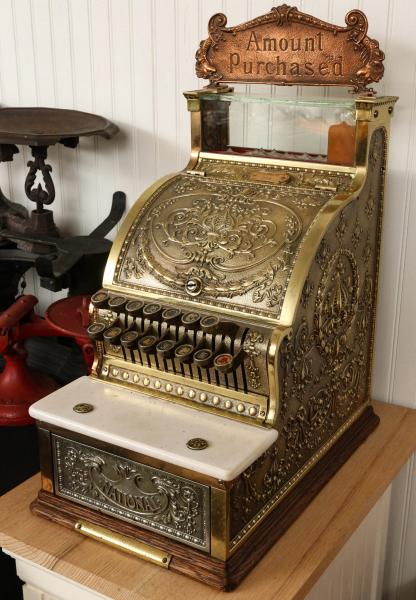 Appraisal: A NATIONAL CASH REGISTER MODEL WITH TOP SIGNThe fleur-de-lis pattern