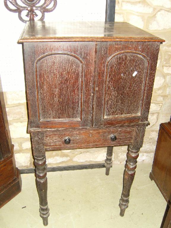 Appraisal: A Victorian oak map cabinet enclosed by a pair of