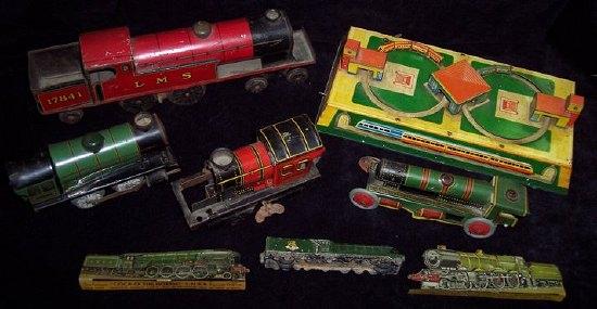 Appraisal: A clockwork tinplate toy of two trains on a circular