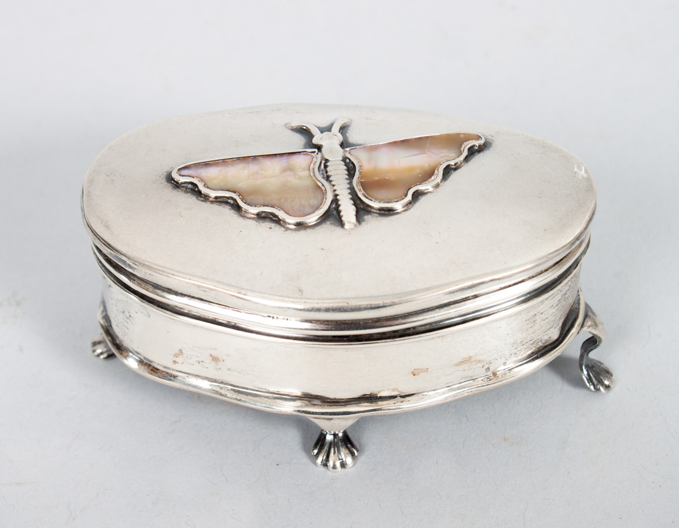 Appraisal: English sterling silver hinged trinket box with mother-of-pearl butterfly on