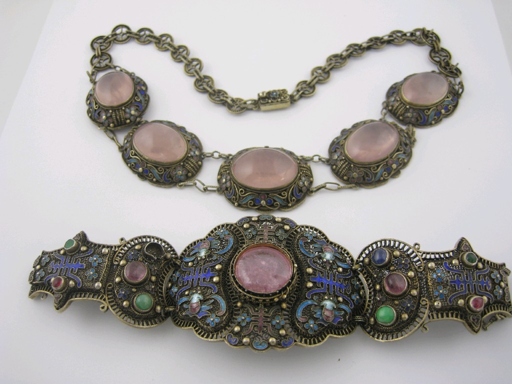 Appraisal: A Chinese Rose Quartz and Enamel Necklace the front collet-set