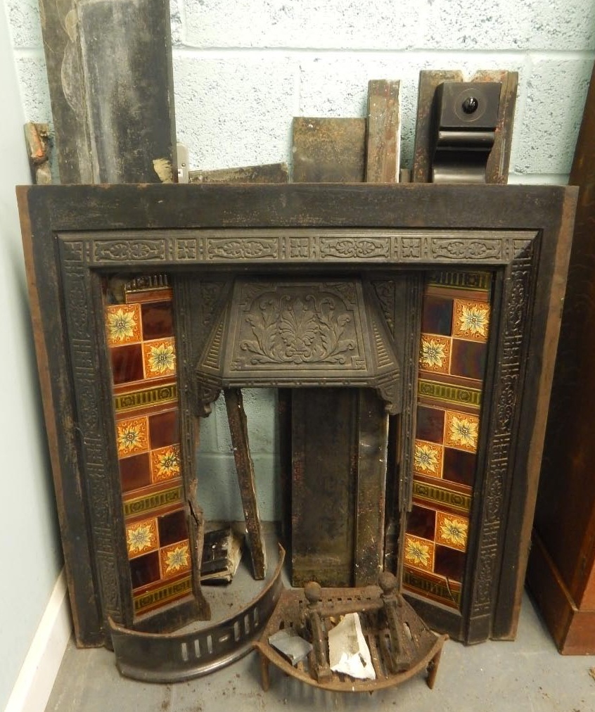 Appraisal: A Victorian black slate fireplace the cast iron insert applied