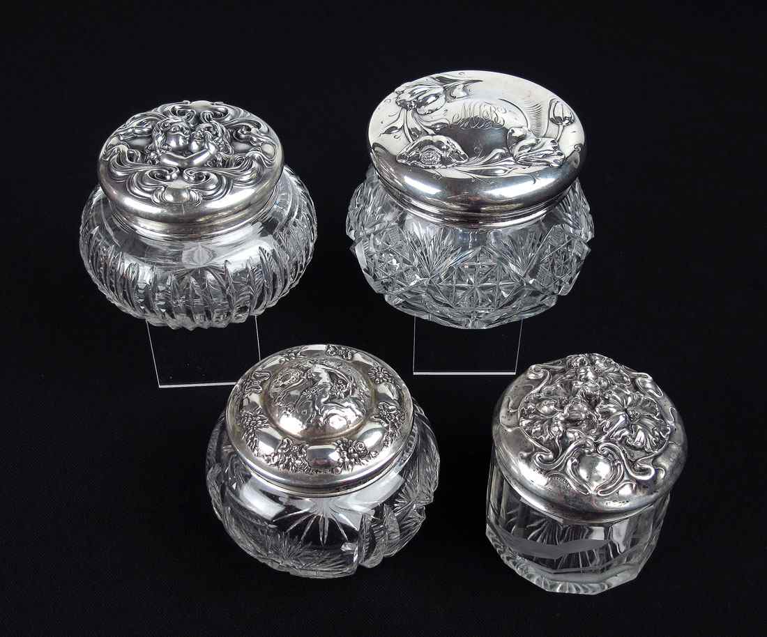 Appraisal: ART NOUVEAU STERLING LIDDED DRESSER JARS To include Wallace winged