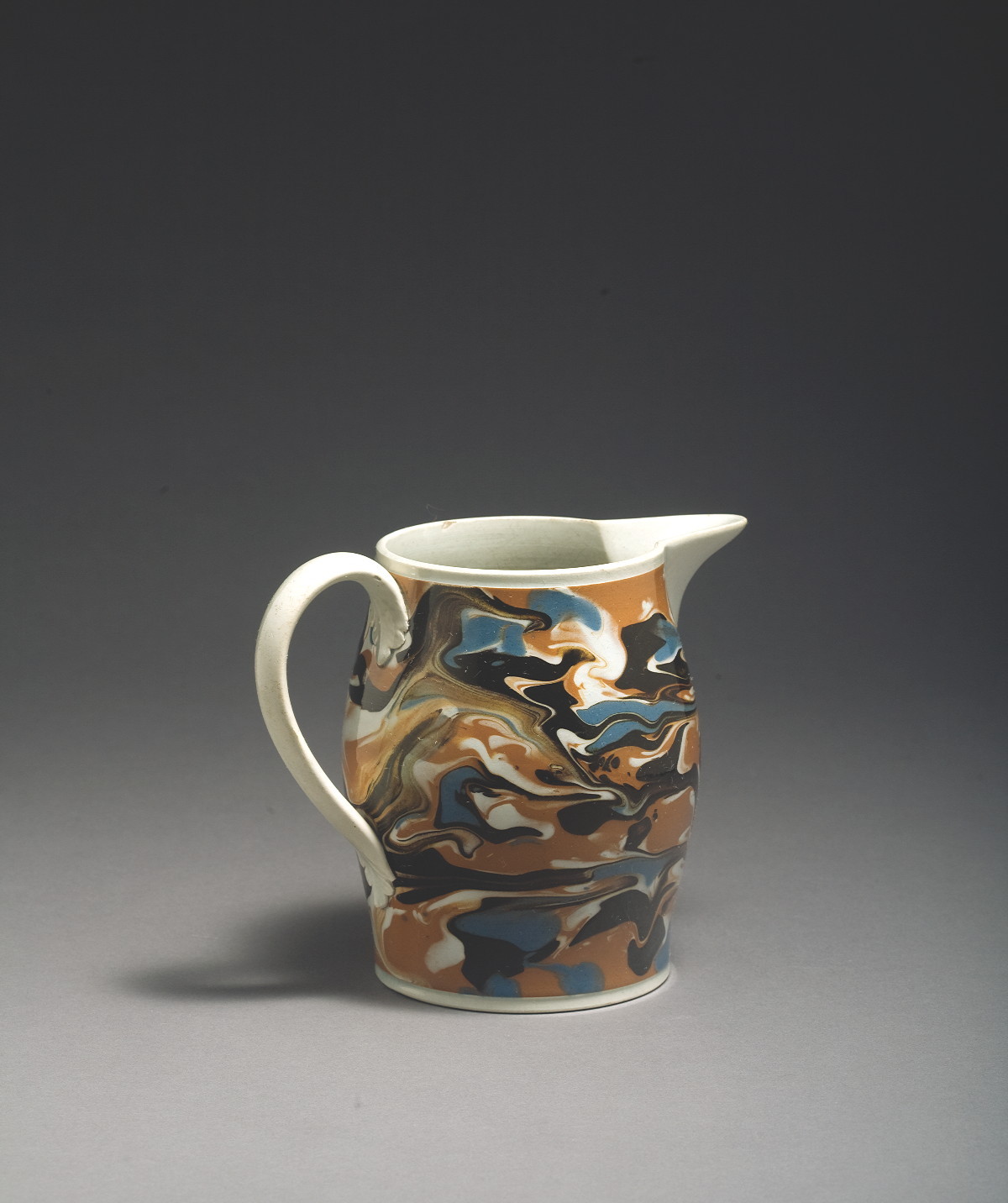 Appraisal: BRITISH PEARLWARE MOCHAWARE JUG CIRCA - Of baluster form slip-marbled