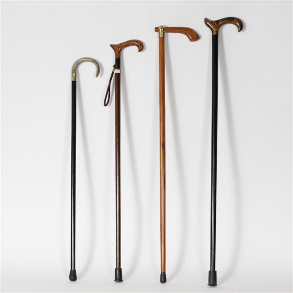 Appraisal: Four exotic mixed wood canes one with baleen handle