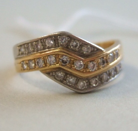 Appraisal: A gold and platinum diamond set half hoop ring mounted