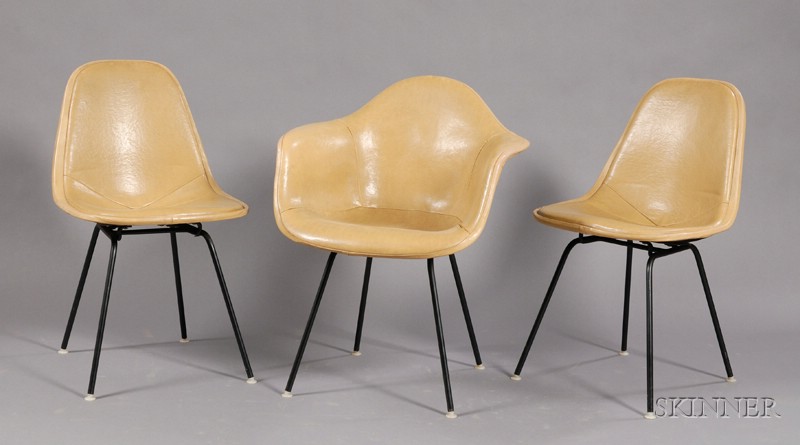 Appraisal: Eames Armchair and Two Side Chairs Metal and upholstery Bucket-seat