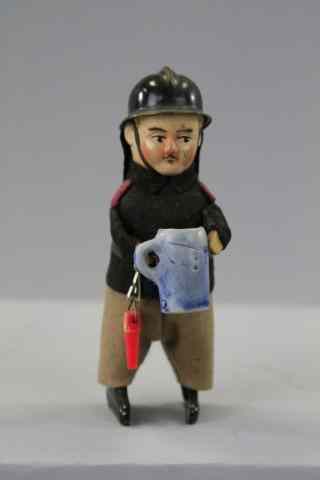 Appraisal: SCHUCO FIREMAN WITH STEIN Germany scarce example depicted with plastic