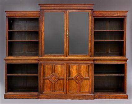 Appraisal: VICTORIAN CARVED MAHOGANY BREAKFAST BOOKCASE The molded cornice above a