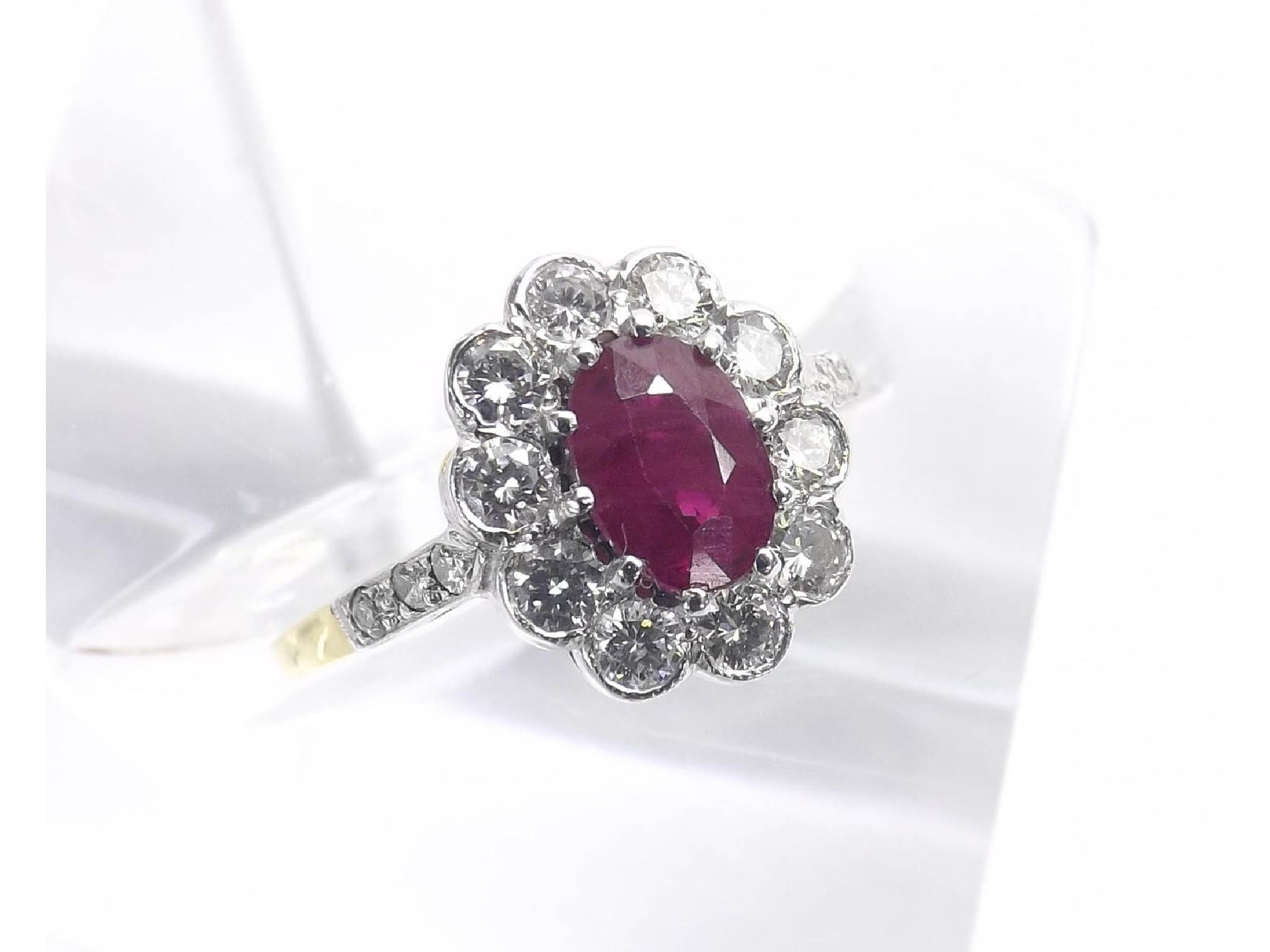 Appraisal: Ruby and diamond oval cluster ring in k yellow and