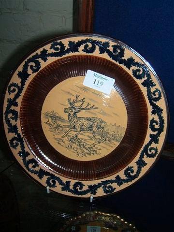 Appraisal: A late th Century stoneware plate with scratch work decoration