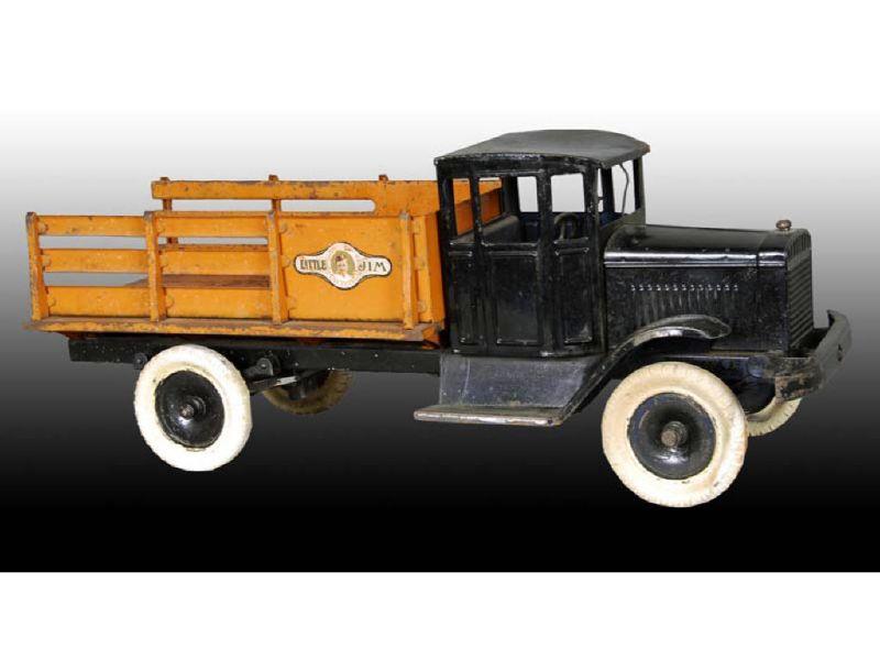 Appraisal: Pressed Steel Motor Driven Stake Truck Toy Description - ''