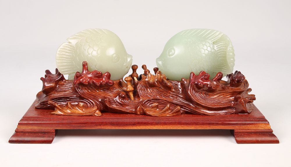 Appraisal: Pair of Jade Fish on Wooden Stand Pair of Jade