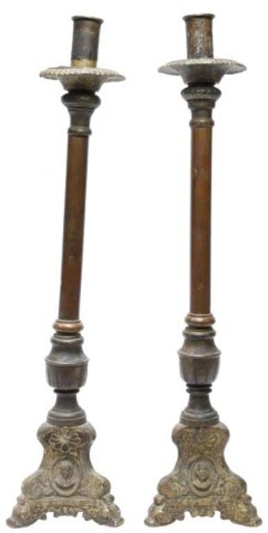 Appraisal: pair Patinated metal altar candlesticks having ribbed bobeche over cylindrical