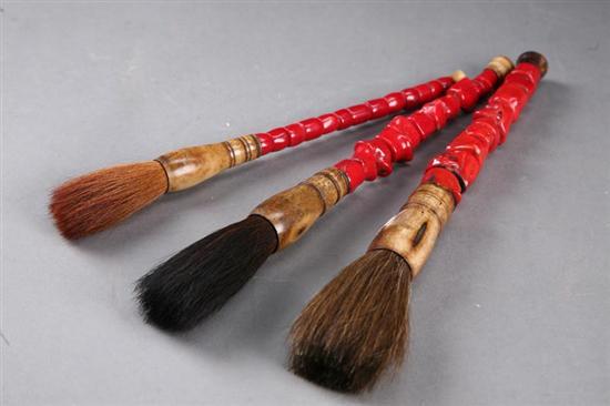 Appraisal: THREE CALLIGRAPHY BRUSHES Asian late th- th century Red coral