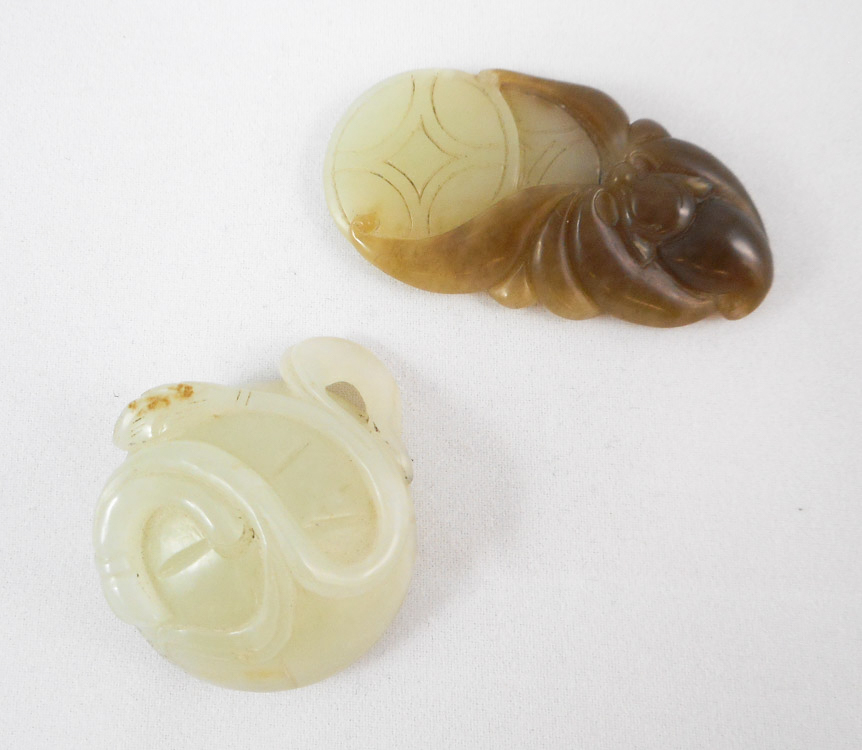 Appraisal: TWO GREEN JADE CARVINGS the first of a bat with