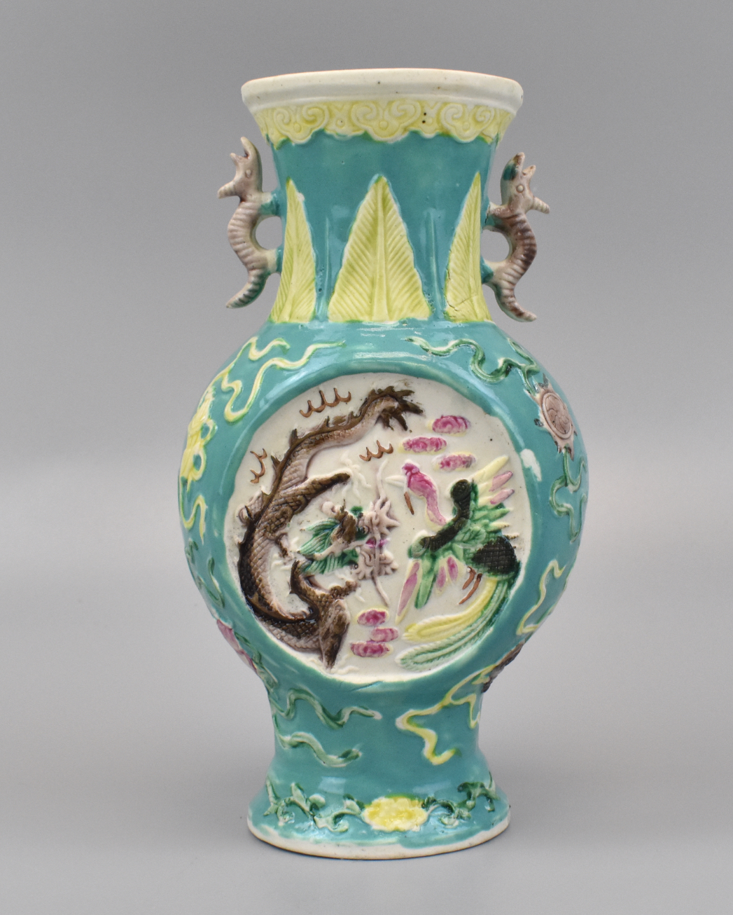 Appraisal: A Chinese famlle rose vase with incised dragon phoenix illustration