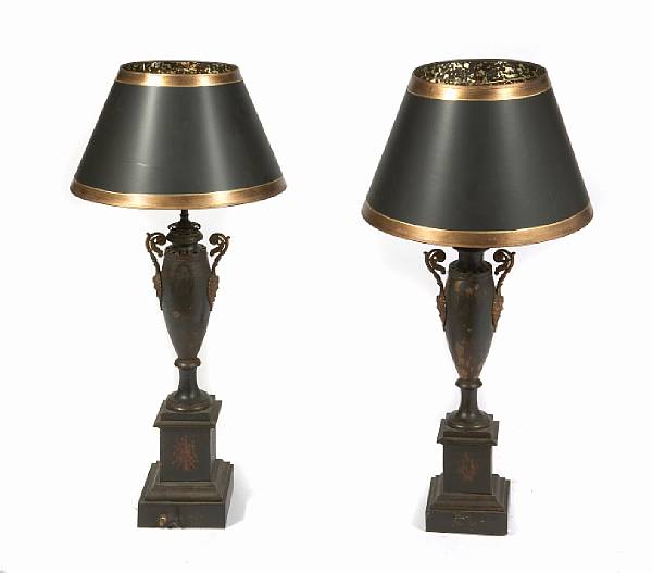 Appraisal: A pair of French gilt metal mounted toleware table lamps