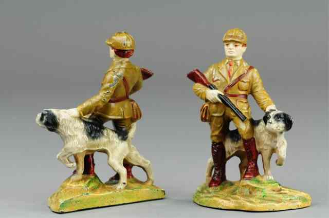 Appraisal: HUNTER WITH DOG BOOKENDS Hubley cast iron depicted with shotgun