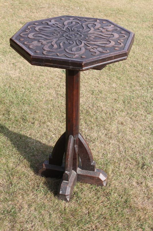 Appraisal: A thC Pugin style octagonal pedestal table with carved decoration