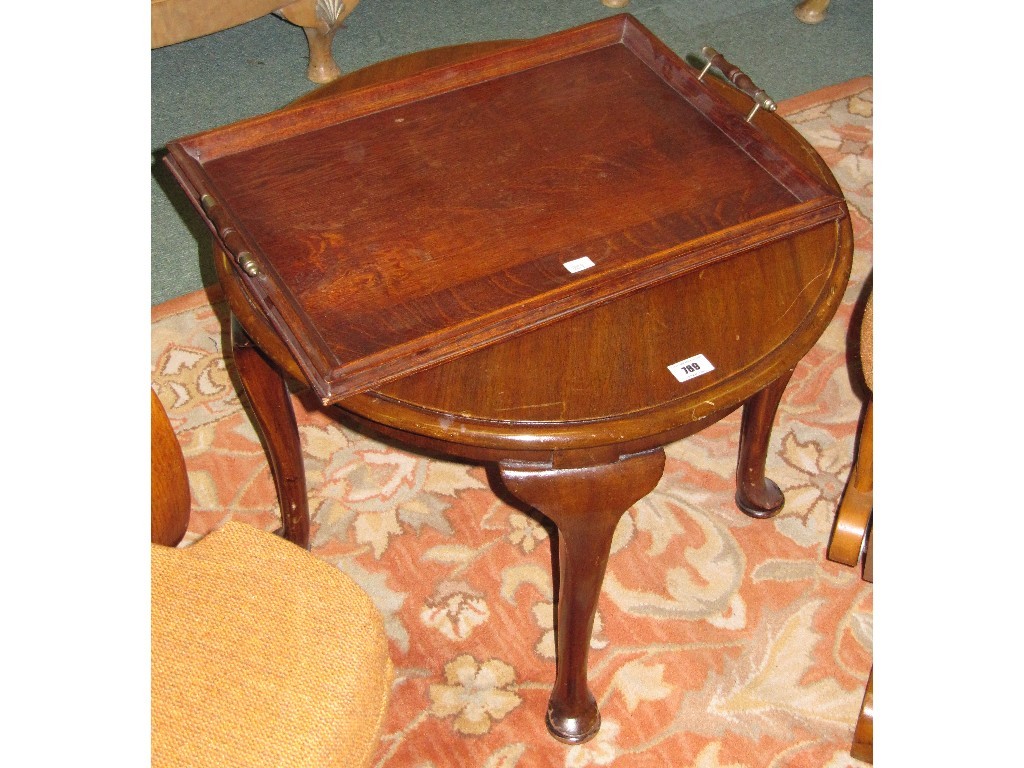 Appraisal: Circular coffee table and an oak serving tray