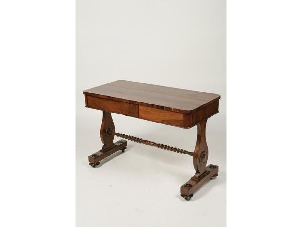 Appraisal: A REGENCY ROSEWOOD LIBRARY TABLE the rectangular top with rounded