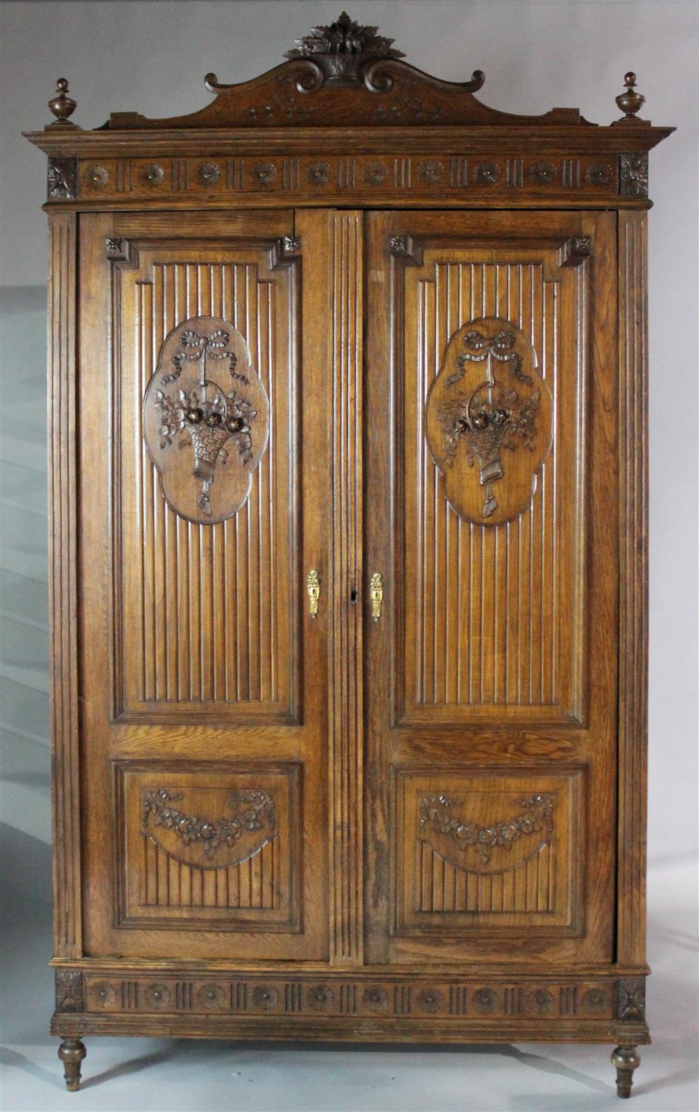 Appraisal: TH OR EARLY TH CENTURY OAK ARMOIRE having a basket