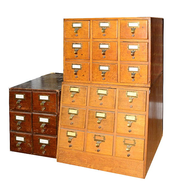 Appraisal: A PAIR OF LIGHT OAK CARD INDEX CABINETS each fitted