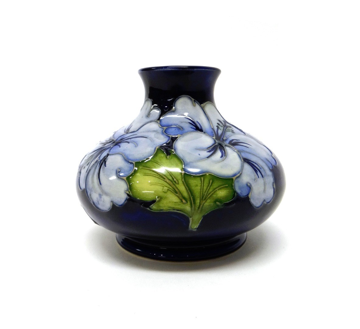 Appraisal: A Moorcroft 'Hibiscus' blue ground vase mid th century cm