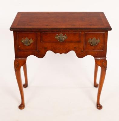 Appraisal: A burr yew kneehole table with surround of three drawers