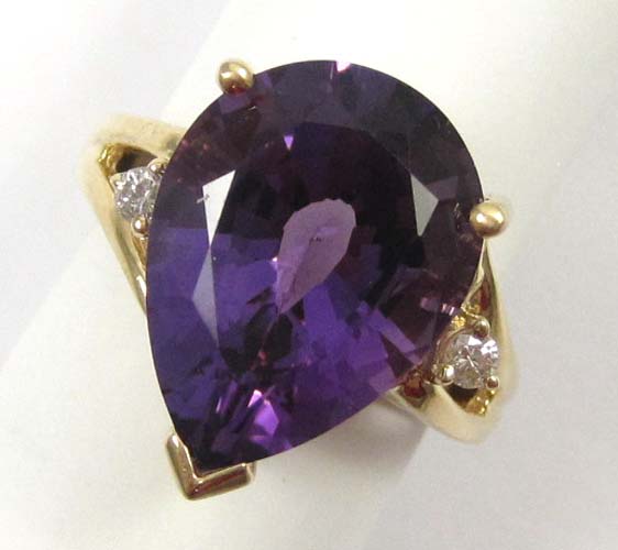 Appraisal: AMETHYST DIAMOND AND FOURTEEN KARAT GOLD RING set with a