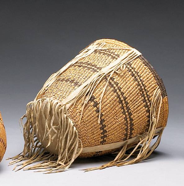 Appraisal: An Apache burden basket With three horizontal decorative bands below